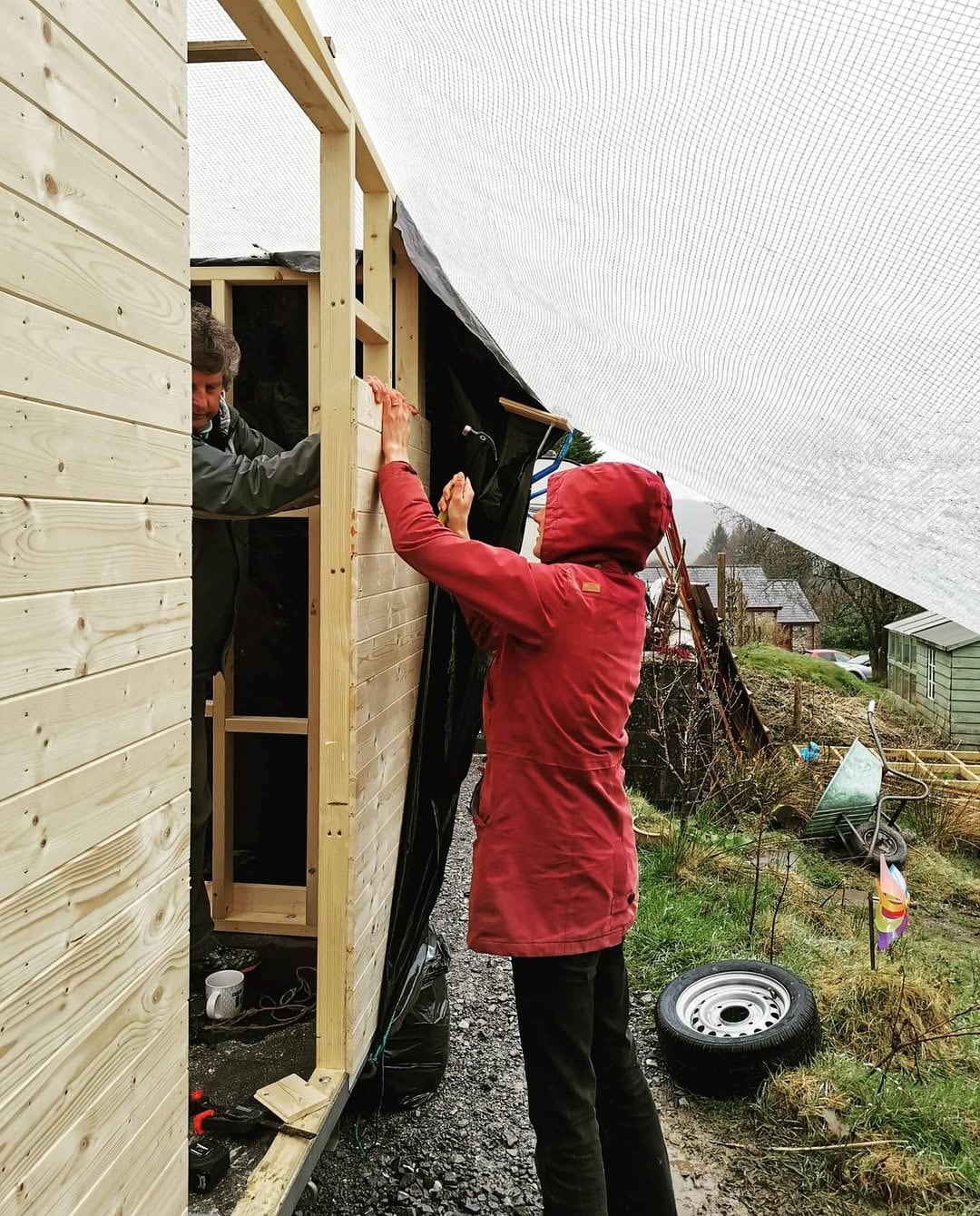 Family members working together on the timber structure